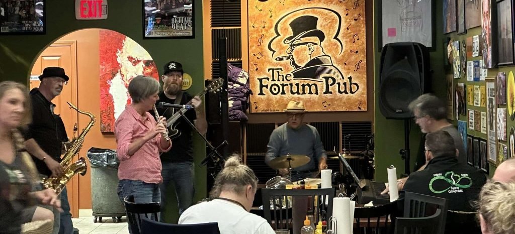 Musicians playing live music at The Forum Pub